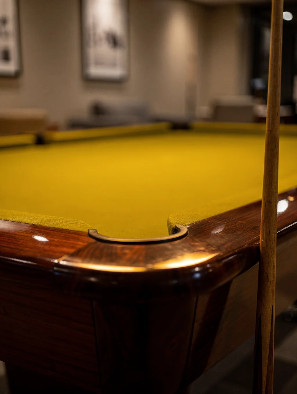 Russian pyramid heavy slate billiards table with white phenolic balls under focused lights